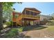 Spacious backyard with a deck, patio, and lush landscaping, ideal for outdoor enjoyment at 1670 Bookhout Dr, Cumming, GA 30041