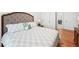 Bedroom with wood floors, upholstered headboard, and stylish bedspread at 1670 Bookhout Dr, Cumming, GA 30041