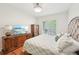 Bedroom with wood floor, furniture and a view from the window at 1670 Bookhout Dr, Cumming, GA 30041