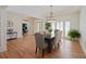 Bright dining room featuring hardwood floors, a modern chandelier, and ample natural light at 1670 Bookhout Dr, Cumming, GA 30041