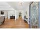 Bright foyer featuring hardwood floors, a decorative glass front door, and an open floor plan at 1670 Bookhout Dr, Cumming, GA 30041