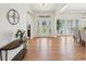 Bright, spacious foyer with hardwood floors, elegant lighting, and a decorative front door at 1670 Bookhout Dr, Cumming, GA 30041