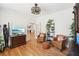 Home office featuring wood floor, comfy chairs and lots of plants at 1670 Bookhout Dr, Cumming, GA 30041