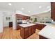 Spacious kitchen featuring a large island with white countertops and custom wood cabinetry at 1670 Bookhout Dr, Cumming, GA 30041