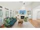 Cozy living room with fireplace, built-in shelving, and large windows that offer plenty of light at 1670 Bookhout Dr, Cumming, GA 30041
