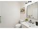 Elegant powder room featuring a modern vanity, sleek fixtures, and stylish decor at 1670 Bookhout Dr, Cumming, GA 30041