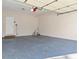 Open garage with epoxy floors and white door at 2317 Rocksram Ct, Buford, GA 30519