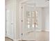 Bright, neutral space with hardwood floors and a glass paneled door allowing an abundance of light at 2317 Rocksram Ct, Buford, GA 30519