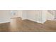 Bright living area featuring hardwood floors, neutral paint, and a staircase nearby at 2317 Rocksram Ct, Buford, GA 30519