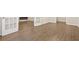 Bright living area featuring hardwood floors, neutral paint, and glass french doors at 2317 Rocksram Ct, Buford, GA 30519