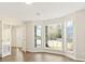 Open concept living room with large windows and hardwood floors at 2317 Rocksram Ct, Buford, GA 30519