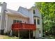 Rear elevation of home featuring an ample deck ideal for relaxation and entertaining at 2317 Rocksram Ct, Buford, GA 30519
