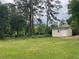 Large backyard with a storage shed at 820 Emerald Forest Cir, Lawrenceville, GA 30044