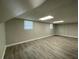 Finished basement area with neutral walls and wood-look flooring; great for entertaining or relaxing at 820 Emerald Forest Cir, Lawrenceville, GA 30044