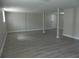 Finished basement area with neutral walls and wood-look flooring; great for entertaining or relaxing at 820 Emerald Forest Cir, Lawrenceville, GA 30044