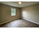 This bedroom features modern flooring and a window at 820 Emerald Forest Cir, Lawrenceville, GA 30044