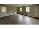 Spacious room featuring attractive floors, and multiple windows providing natural light at 820 Emerald Forest Cir, Lawrenceville, GA 30044