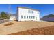 Exterior view of a two-story home featuring white siding, a well-manicured lawn, and ample natural light at 1715 Fulmont Cir, Mableton, GA 30126