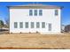 Exterior view of a two-story home featuring white siding, a well-manicured lawn, and ample natural light at 1715 Fulmont Cir, Mableton, GA 30126