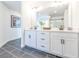 Bright bathroom features double vanity with white cabinets and black hardware at 1715 Fulmont Cir, Mableton, GA 30126