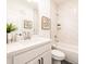 Bright bathroom features modern fixtures, a white vanity, and tiled walls at 1715 Fulmont Cir, Mableton, GA 30126