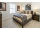 Comfortable bedroom features neutral tones, carpeted floors, and lots of natural light at 1715 Fulmont Cir, Mableton, GA 30126