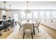 Open concept dining area with stylish furnishings and seamless flow to kitchen and living spaces at 1715 Fulmont Cir, Mableton, GA 30126