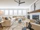 Open concept living space with a comfortable sofa, fireplace, and plenty of natural light at 1715 Fulmont Cir, Mableton, GA 30126