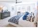 Bright main bedroom features carpeted floors, ceiling fan, and ensuite bathroom at 1715 Fulmont Cir, Mableton, GA 30126