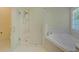 Modern bathroom with glass enclosed shower and separate soaking tub at 1871 Birch Briar Bnd, Lawrenceville, GA 30043