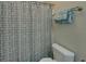 Cozy bathroom features shower with decorative curtain and soft towels at 1871 Birch Briar Bnd, Lawrenceville, GA 30043
