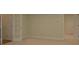 Large room featuring a view, neutral carpet and a french door at 1871 Birch Briar Bnd, Lawrenceville, GA 30043