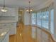 Breakfast nook featuring light-filled windows with wooded views and chandelier at 1871 Birch Briar Bnd, Lawrenceville, GA 30043