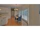 Sunny dining area with hardwood floors and natural light; ideal for Gathering meals and entertaining guests at 1871 Birch Briar Bnd, Lawrenceville, GA 30043