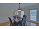 Inviting dining room with hardwood floors and stylish decor with natural lighting at 1871 Birch Briar Bnd, Lawrenceville, GA 30043