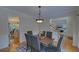Inviting dining room with hardwood floors, modern furnishings and access to other rooms at 1871 Birch Briar Bnd, Lawrenceville, GA 30043