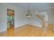 Elegant dining room boasts hardwood floors, classic wainscoting, and access to the kitchen and stairs at 1871 Birch Briar Bnd, Lawrenceville, GA 30043