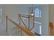Bright foyer with wood railings and staircase showcasing an arched window feature at 1871 Birch Briar Bnd, Lawrenceville, GA 30043