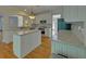 Well-lit kitchen with white cabinetry, stainless steel appliances, and granite countertops at 1871 Birch Briar Bnd, Lawrenceville, GA 30043