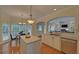 Open-concept kitchen featuring an island, granite countertops, and stainless steel appliances for modern cooking at 1871 Birch Briar Bnd, Lawrenceville, GA 30043
