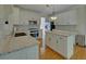 Kitchen featuring granite counters, white cabinets, island, and stainless appliances at 1871 Birch Briar Bnd, Lawrenceville, GA 30043