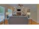 Relaxing living room with hardwood floors, built-in shelves, and a cozy fireplace; the perfect gathering space at 1871 Birch Briar Bnd, Lawrenceville, GA 30043