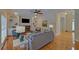 Bright living room with built-in bookshelves, a brick fireplace, and large windows; perfect for entertaining at 1871 Birch Briar Bnd, Lawrenceville, GA 30043