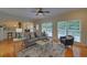Inviting living room with neutral decor, lots of natural light, and an open view of the modern kitchen at 1871 Birch Briar Bnd, Lawrenceville, GA 30043