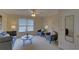Inviting living room features stylish seating, a ceiling fan, and natural light at 1871 Birch Briar Bnd, Lawrenceville, GA 30043