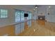 Living room with hardwood floors, fireplace, and built-in shelving at 1871 Birch Briar Bnd, Lawrenceville, GA 30043