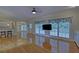 Open living room with hardwood floors and breakfast nook at 1871 Birch Briar Bnd, Lawrenceville, GA 30043