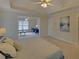 Relaxing main bedroom with an attached lounge, tray ceiling, and lots of sunlight at 1871 Birch Briar Bnd, Lawrenceville, GA 30043