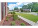 Neighborhood street showcasing landscaped front yards, mature trees and sidewalks, with view from property at 1871 Birch Briar Bnd, Lawrenceville, GA 30043