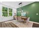 Modern dining room with stylish decor, window view, and accent wall at 24 Becker Nw Pl, Atlanta, GA 30307